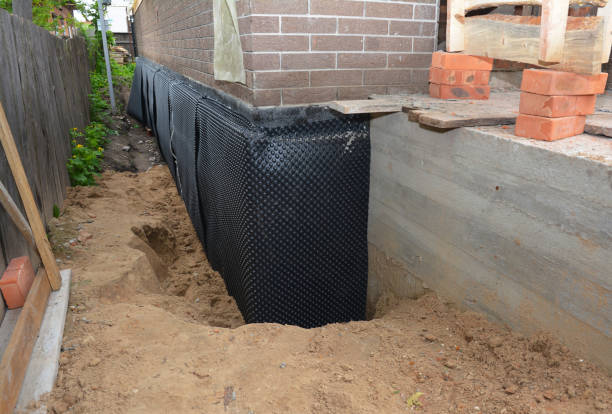 SJ Waterproofing Pros technician performing targeted Sump Pump Installation assessment in Mulga, AL